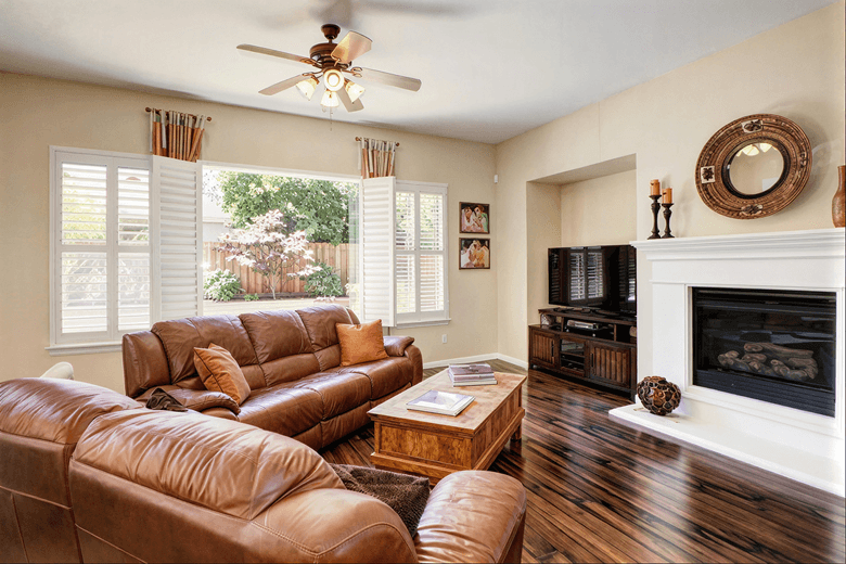 Family room with fireplace and television
