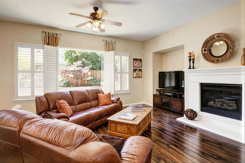 Family room with fireplace and television